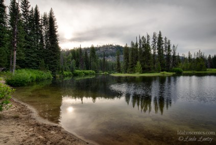 Idaho, West Central, McCall. The North Fork of the Payette River under evening skies on a summer evening as viewed from the North UNit of Ponderosa State Park.